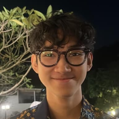 Rizky Mirzaviandy Priambodo, smiling, in a batik shirt
